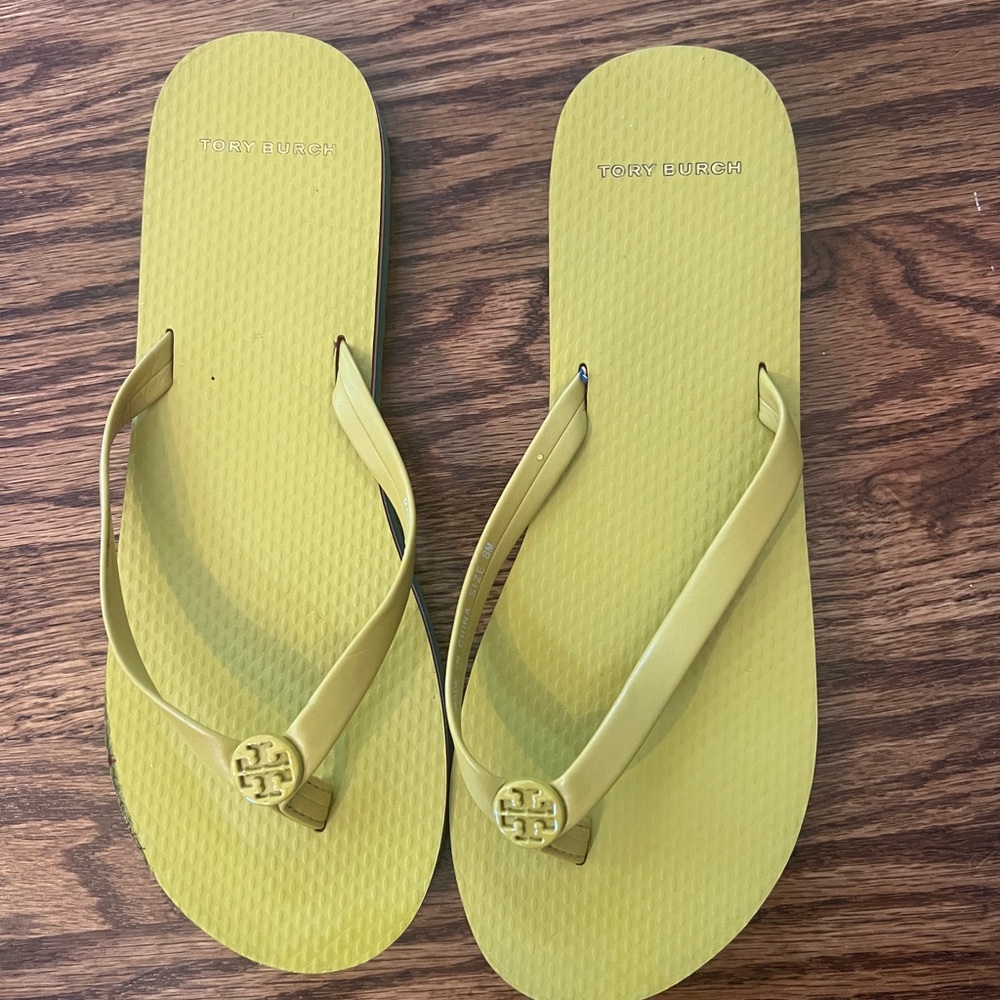Tory Burch flip flops. Size 8. Yellow with multi colored sole. Hardly worn.